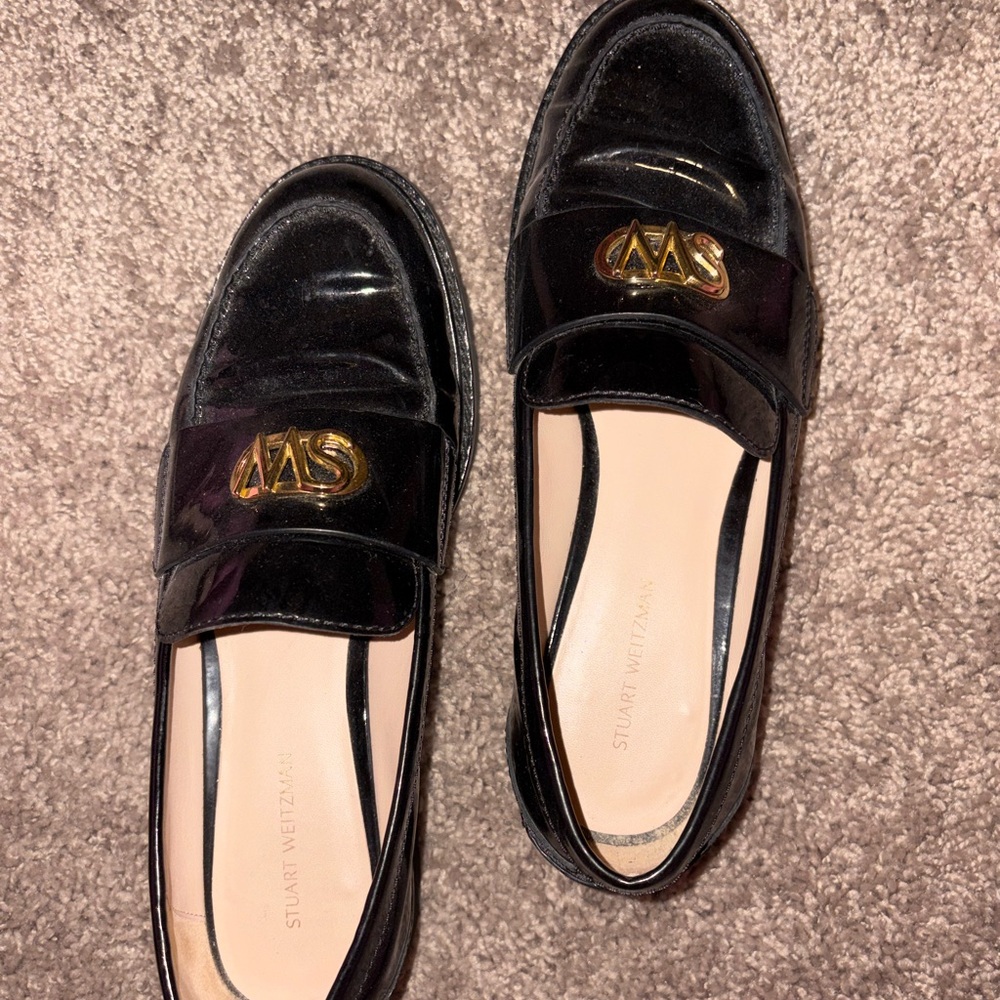 Stuart Weitzman Glossy Black Loafers with Gold Detail